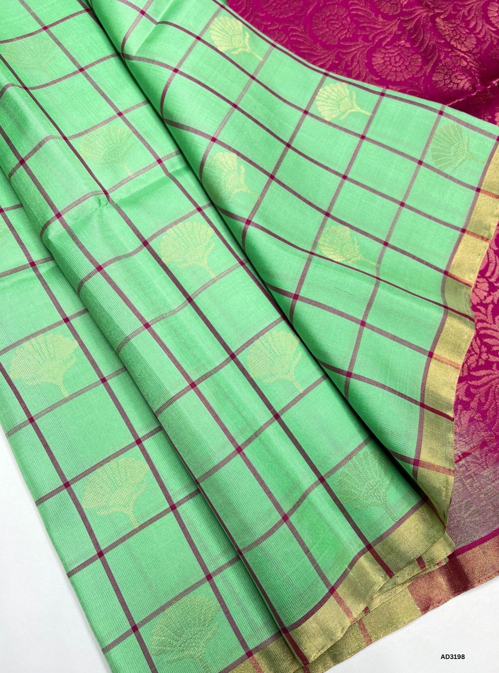 "Handwoven Pista Green body with Pink pallu Checkered Bhutta Soft Silk Saree featuring gold zari motifs and borders"