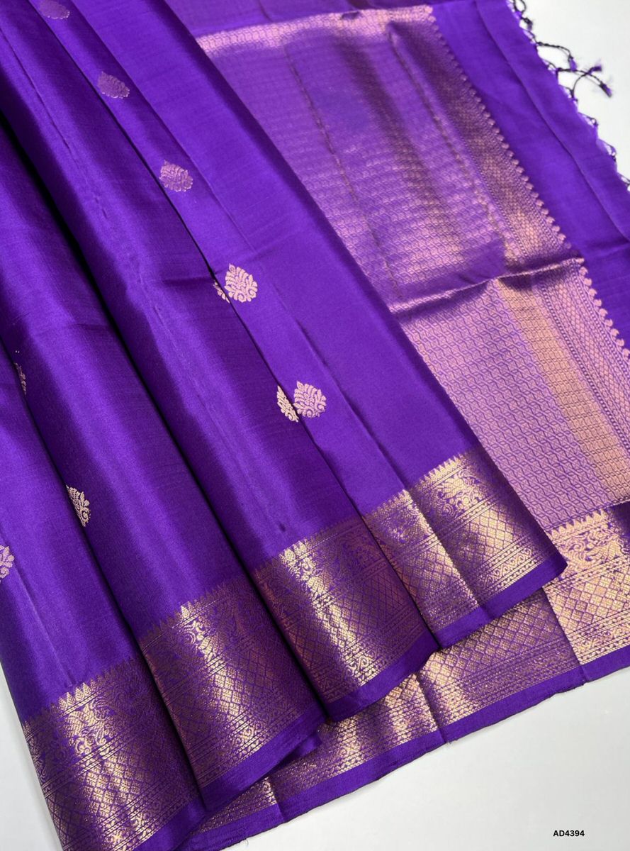The Purple Kanchi Border Soft Silk Saree is a majestic handwoven creation that radiates cultural richness and festive elegance. The regal purple shade symbolizes devotion, prosperity, and timeless sophistication, while the traditional Kanchi border enriched with pure gold zari elevates its grandeur. With its lustrous drape and coordinated blouse, this saree is perfect for weddings, temple ceremonies, and cultural gatherings. A timeless piece of artistry, it blends jewel‑tone vibrance with the heritage of Ka