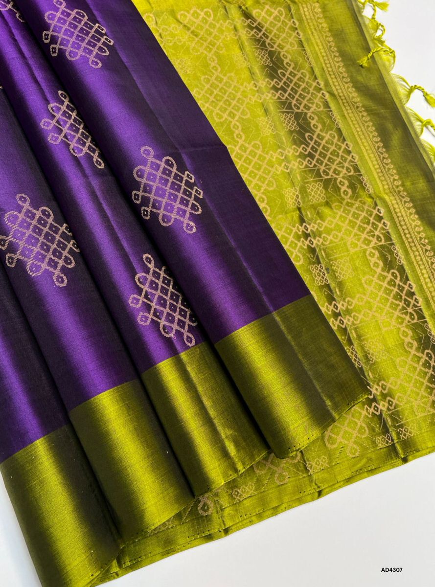 The Purple & Olive Green Soft Silk Saree is a majestic handwoven creation that radiates festive charm and cultural elegance. The regal purple shade symbolizes devotion, prosperity, and sophistication, while the olive green contrast adds earthy balance and heritage richness. With its lustrous drape and zari highlights, this saree is perfect for weddings, temple ceremonies, and festive occasions. A timeless piece, it blends jewel‑tone vibrance with natural serenity in South Indian craftsmanship.