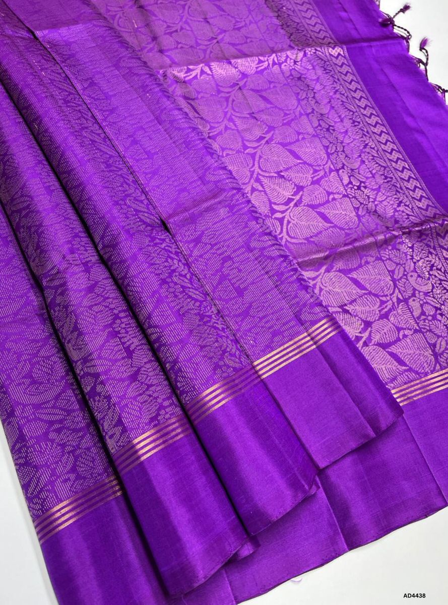 The Purple Soft Silk Bridal Saree with Half Fine Tested Gold Zari is a regal handwoven creation that radiates devotion, elegance, and timeless charm, making it ideal for weddings, receptions, and auspicious occasions.