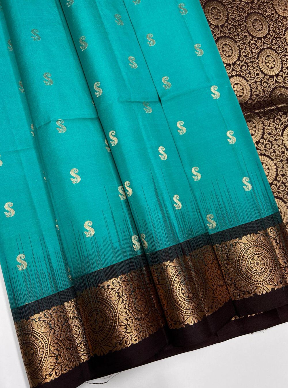 "Handwoven Rama Blue body with Coffee Brown pallu Bhutta Jacquard Border Soft Silk Saree featuring gold zari motifs and borders"