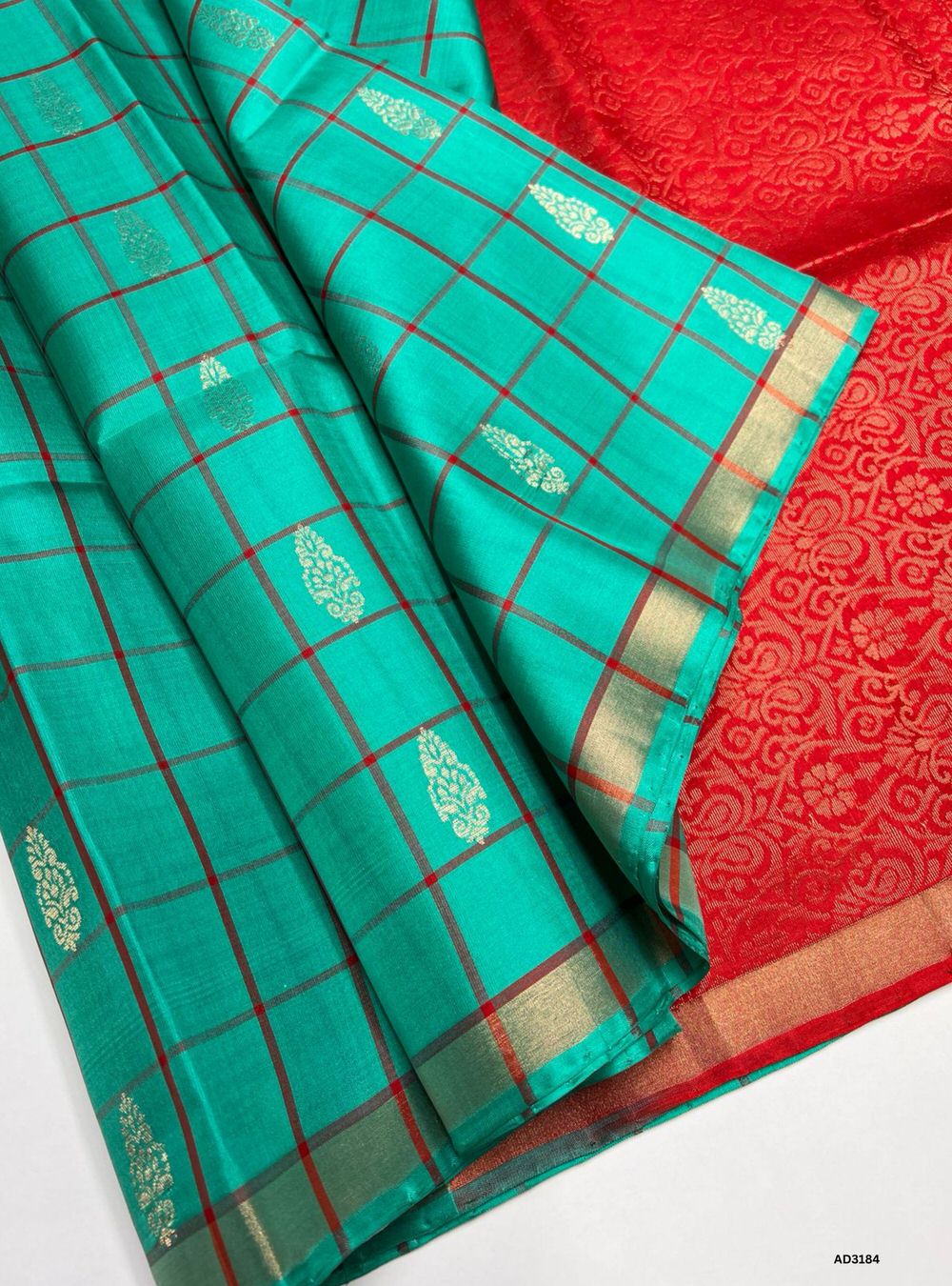 "Handwoven Rama Green body with Red pallu Checkered Bhutta Soft Silk Saree featuring gold zari motifs and borders"