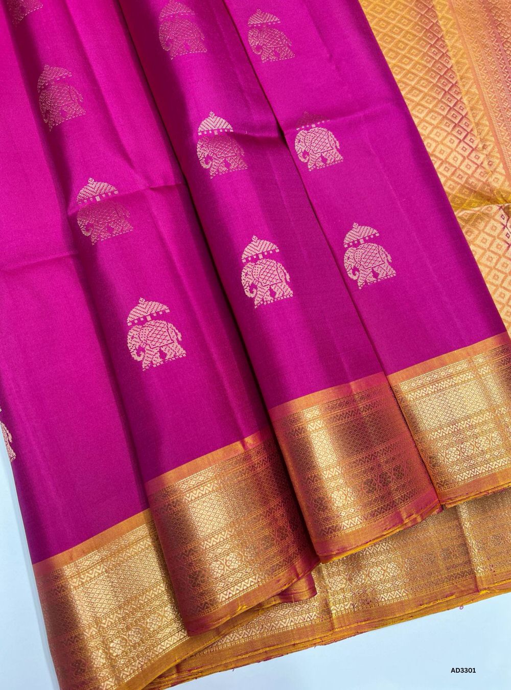 "Handwoven Rani Pink body with Mango Yellow pallu Bhutta Jacquard Border Soft Silk Saree featuring gold zari motifs and borders"