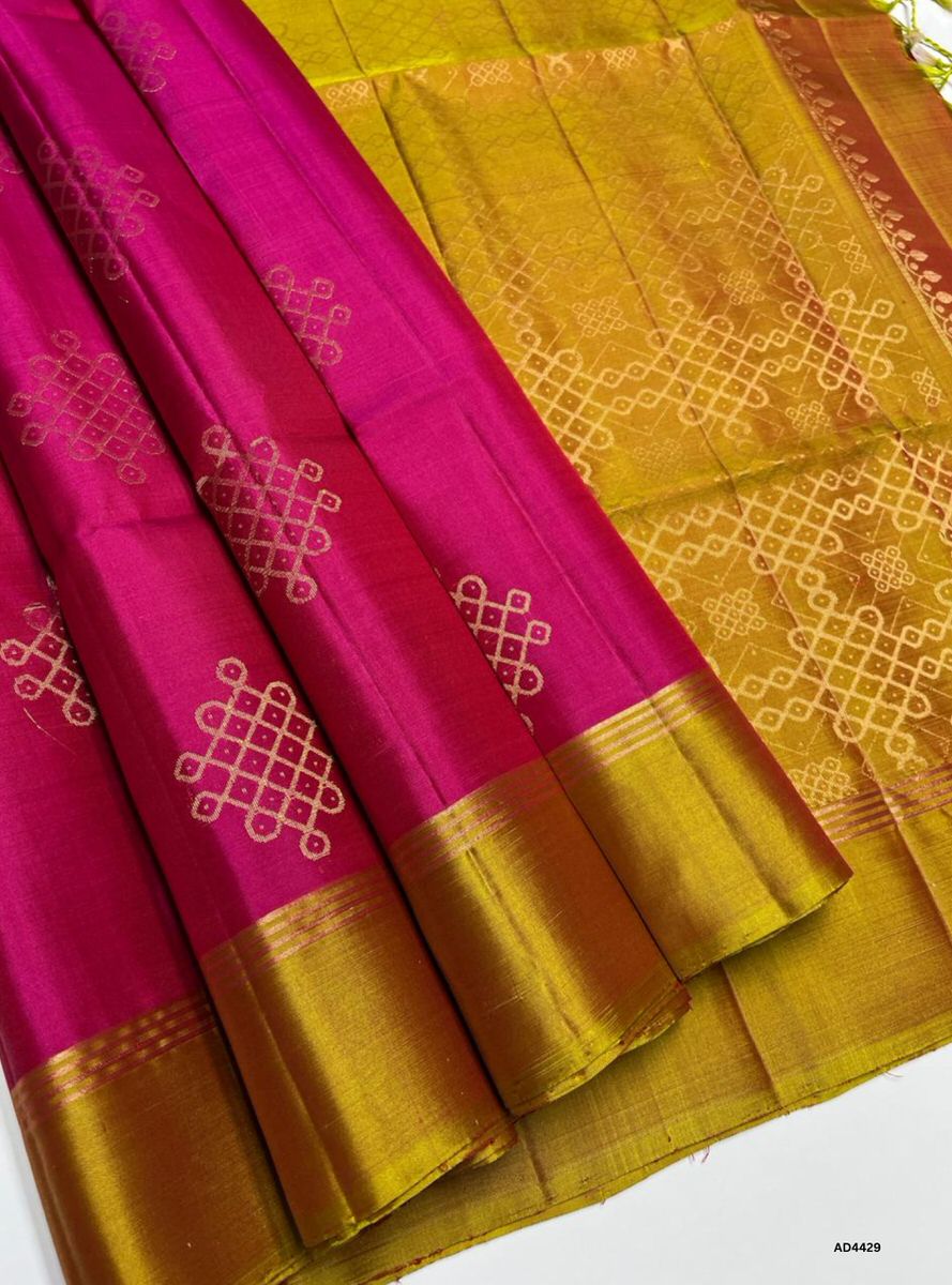 The Red & Dual Tone Yellow Kolam Soft Silk Saree with Pure Gold Zari is a radiant handwoven creation that unites auspicious brilliance with festive warmth, making it ideal for weddings, temple ceremonies, and cultural celebrations.