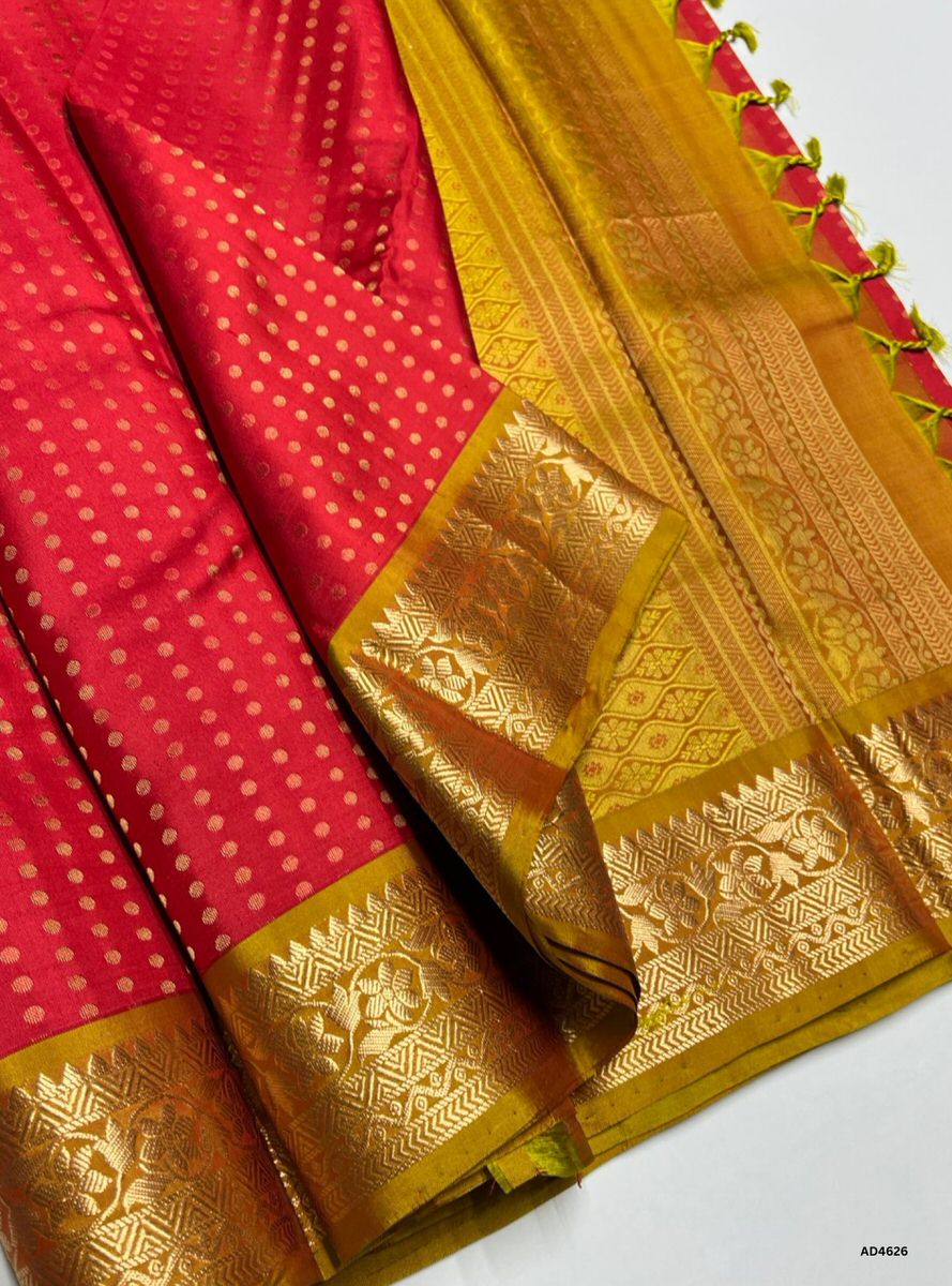 The Red & Golden Kanchi Border Soft Silk Saree with 1000 Bhutta and Half Fine Tested Gold Zari is a radiant handwoven creation that unites festive brilliance with regal charm, making it perfect for weddings, temple ceremonies, and cultural celebrations.