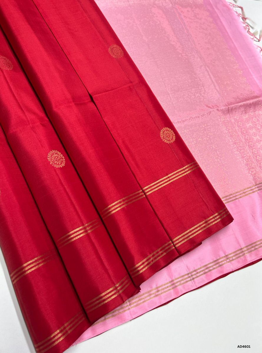 The Red & Pink Bhutta Soft Silk Saree with Pure Gold Zari is a radiant handwoven creation that unites festive vibrance with feminine elegance, enriched by intricate bhutta motifs, making it ideal for weddings, temple ceremonies, and cultural occasions.