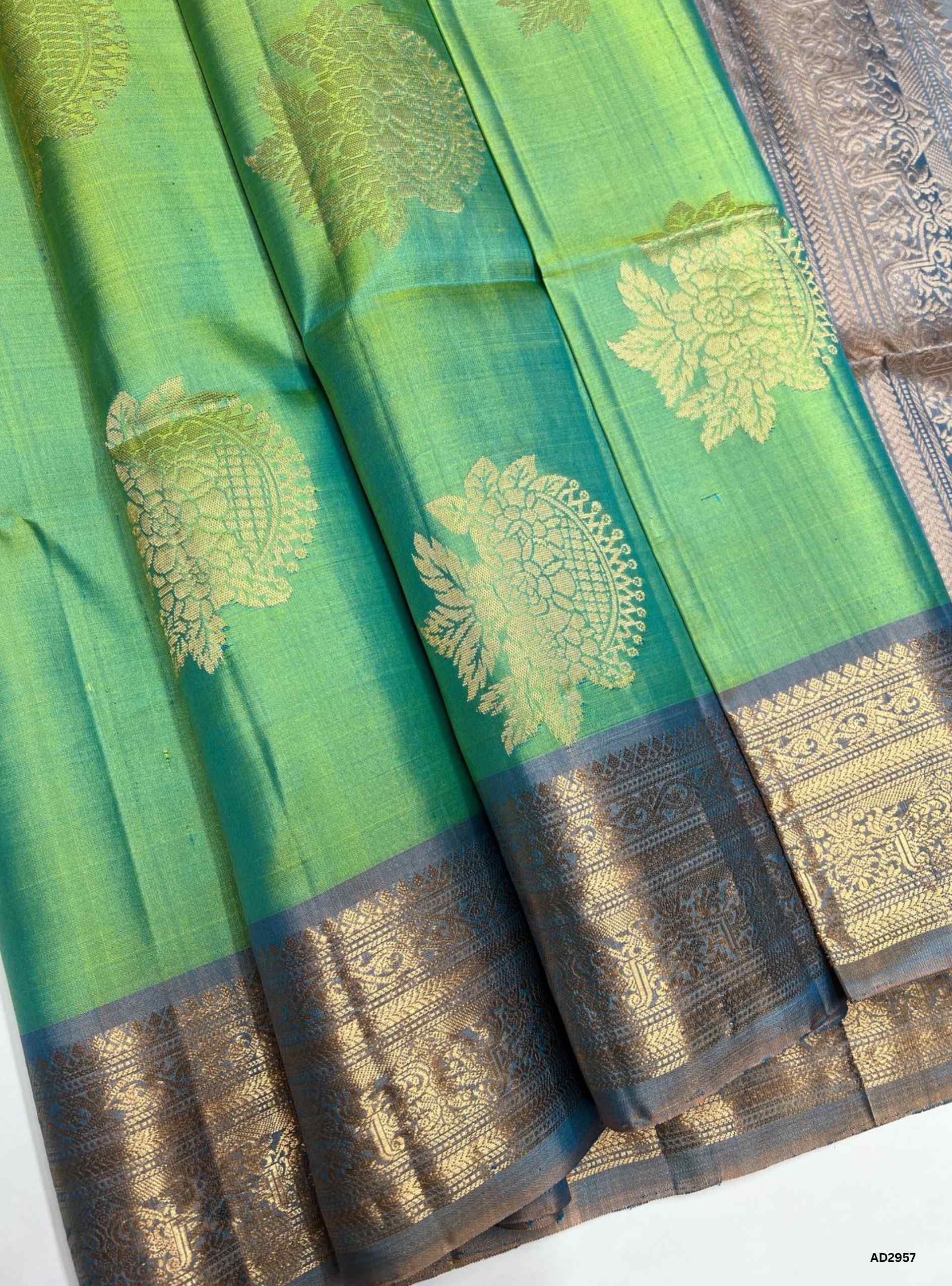 "Handwoven Rexona body with Light Blue pallu Bhutta Jacquard Border Soft Silk Saree featuring gold zari motifs