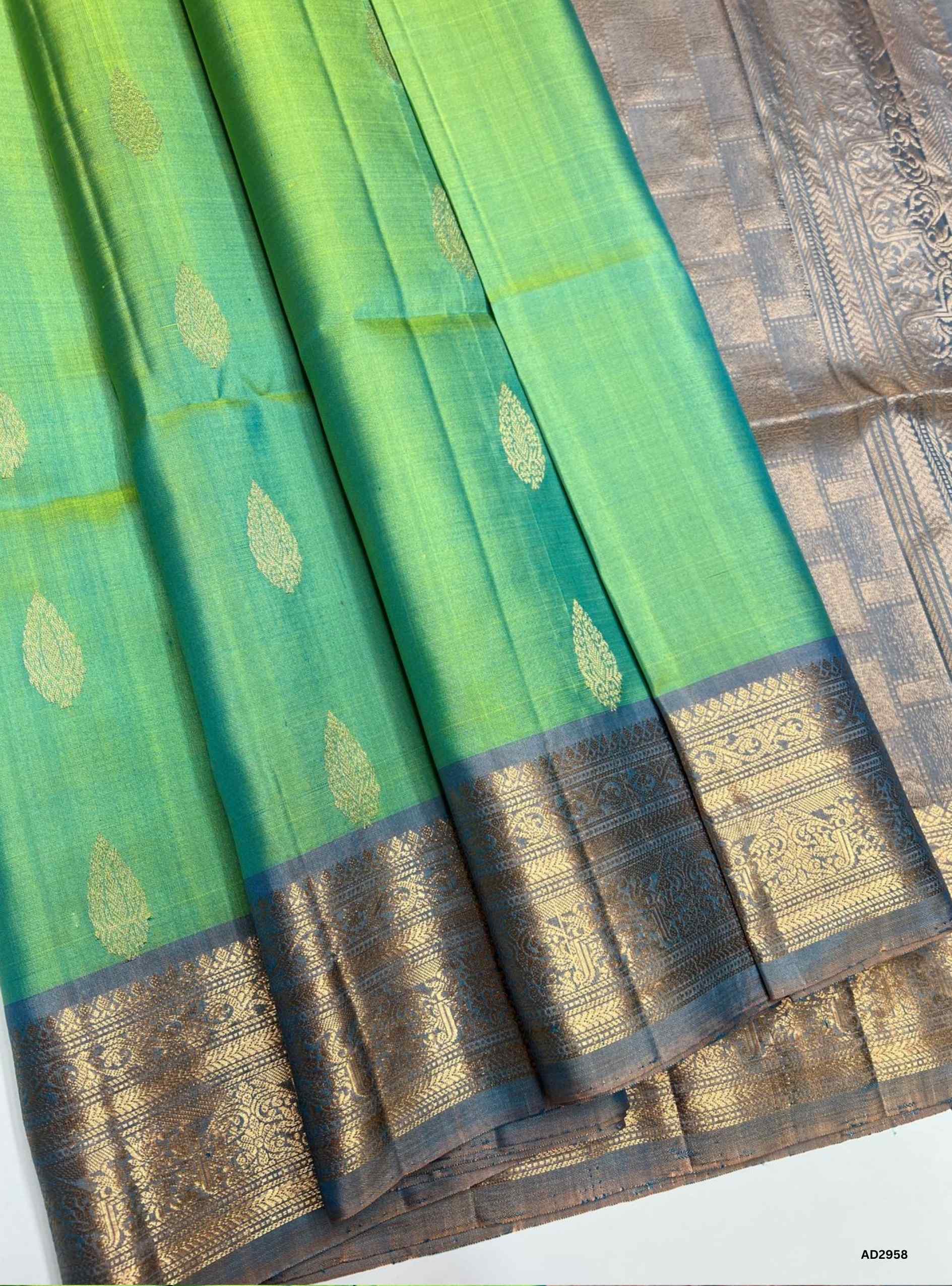 "Handwoven Rexona body with Pale Blue pallu Bhutta Jacquard Border Soft Silk Saree featuring gold zari motifs"