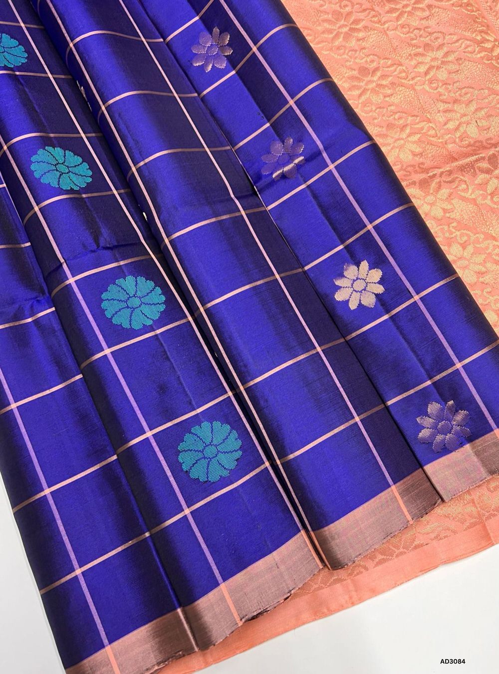"Handwoven Royal Blue body with Peach pallu Checkered Bhutta Soft Silk Saree featuring gold zari motifs and borders"