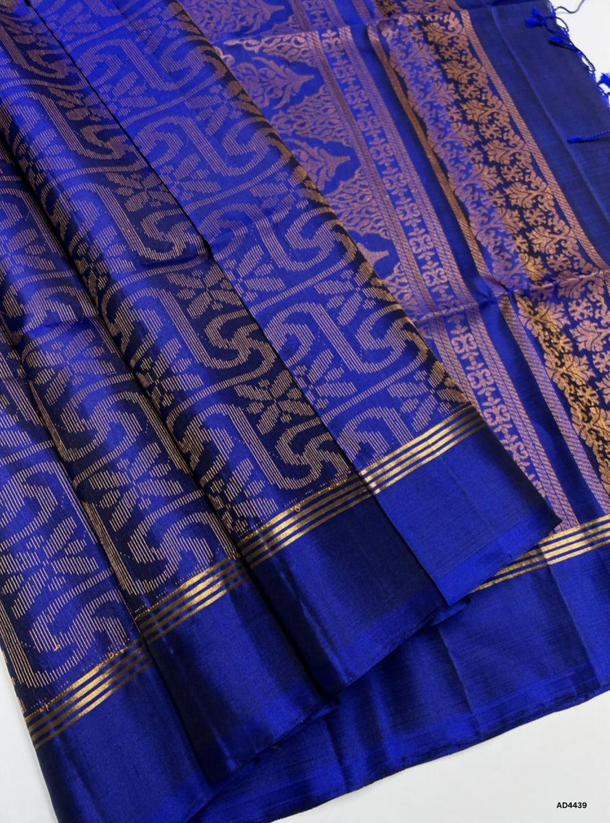 The Royal Blue Soft Silk Bridal Saree with Half Fine Tested Gold Zari is a regal handwoven creation that radiates majesty, devotion, and timeless charm, making it ideal for weddings, receptions, and auspicious occasions.