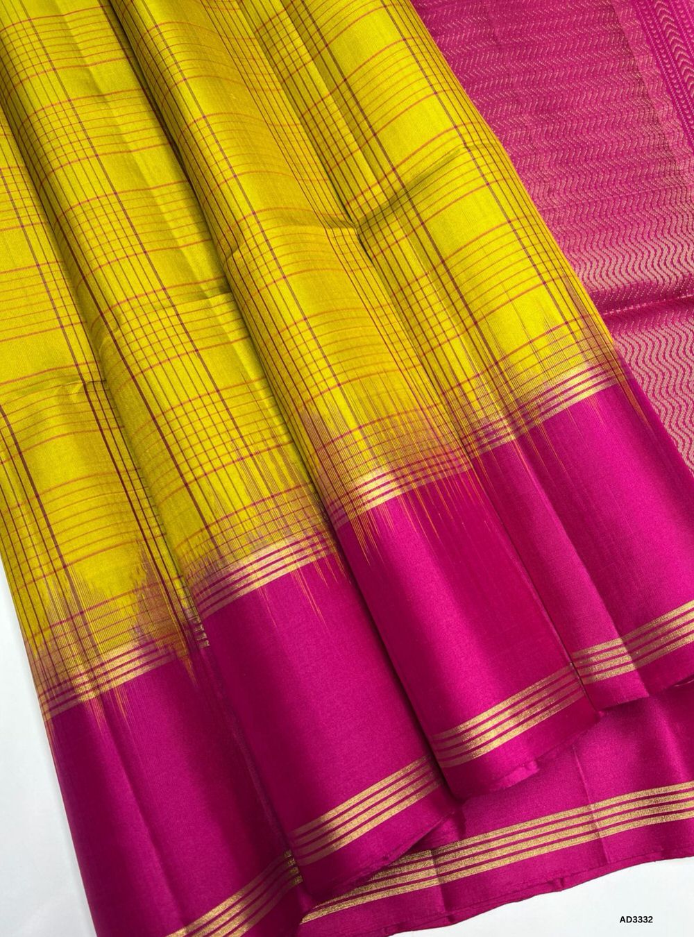 "Handwoven Yellow body with Pink pallu Checkered Soft Silk Saree featuring gold zari motifs and borders"
