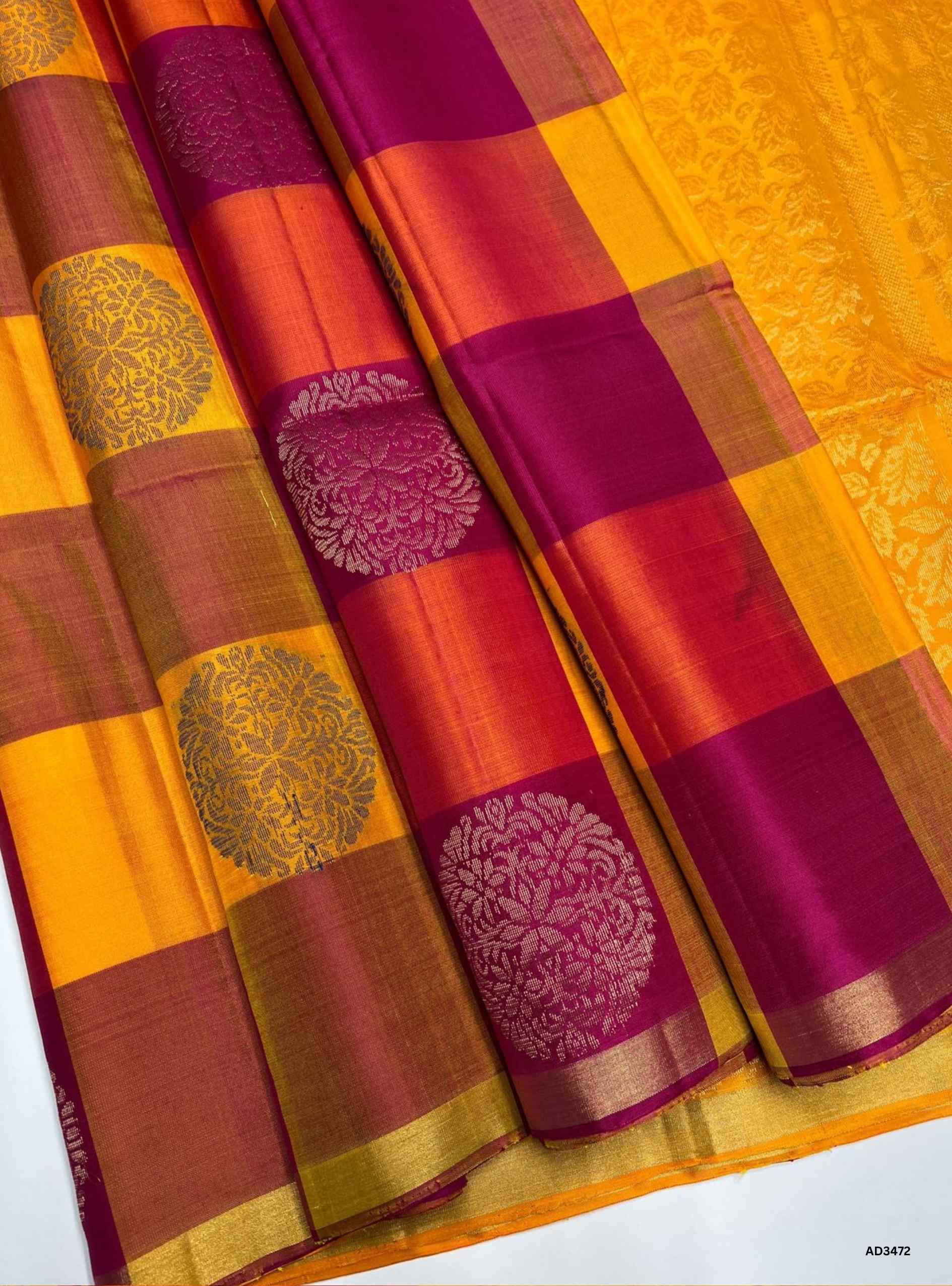 The Yellow & Pink Soft Silk Saree is a vibrant handwoven creation featuring the traditional Pazhum Pazhamum checkered weave. The cheerful yellow base is beautifully contrasted with lively pink checks, while zari accents add a touch of radiance. Perfect for weddings, festive occasions, and cultural gatherings, this saree blends heritage weaving with timeless elegance.