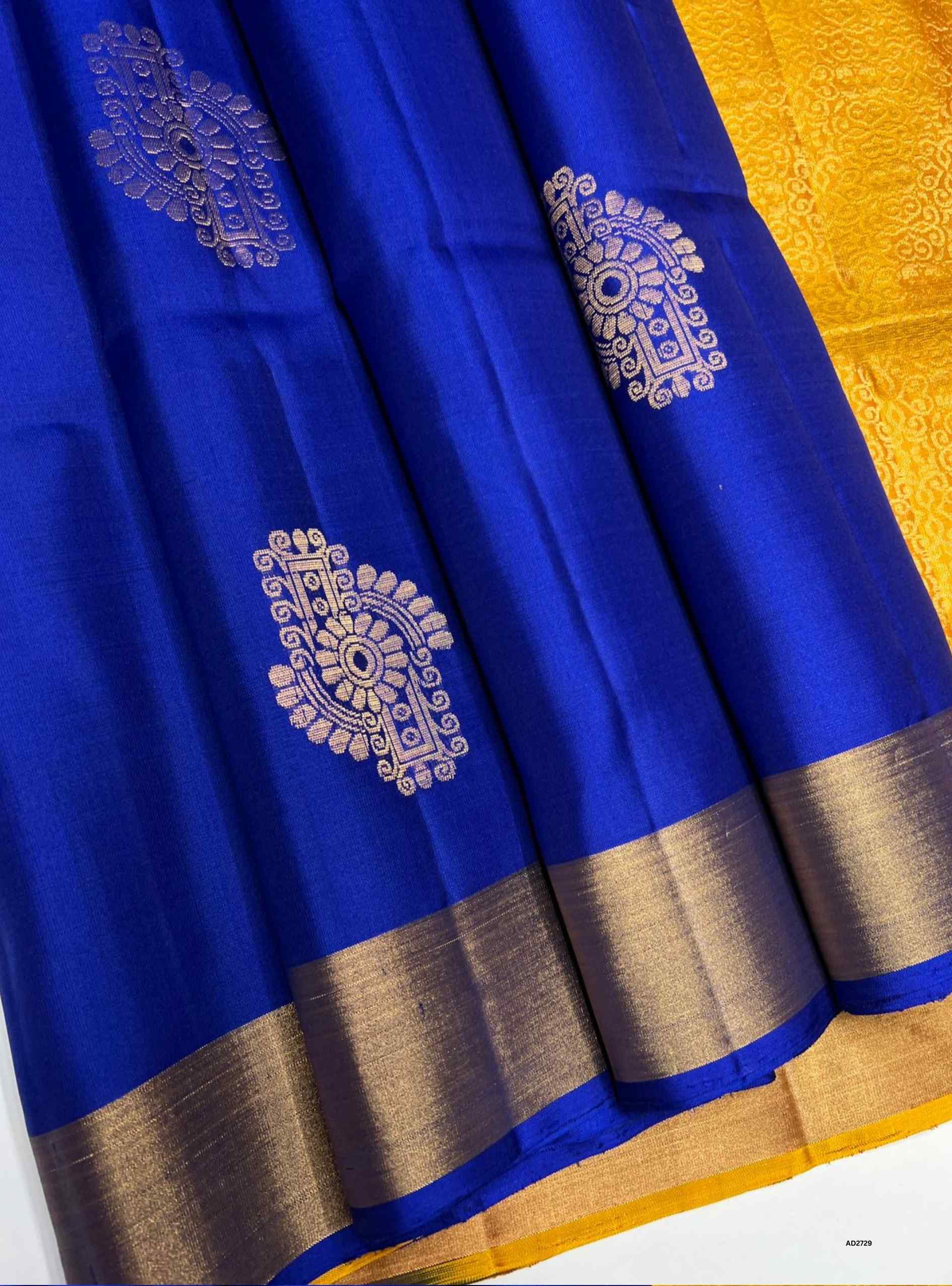 Blue and Yellow Bhutta Soft Silk Saree with gold zari motifs.
