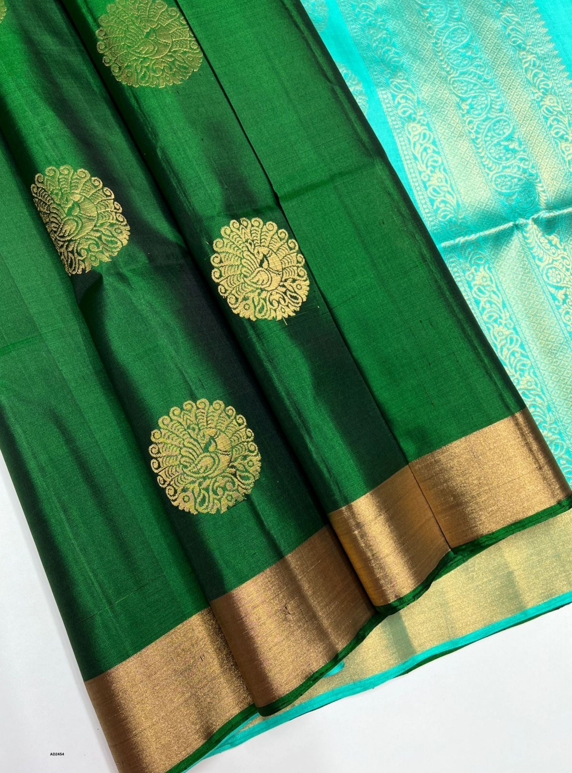 Bottle Green and Aqua Bhutta Soft Silk Saree with gold zari motifs.
