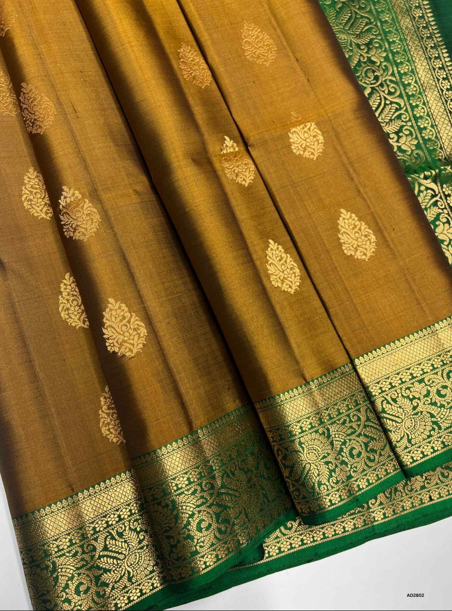Soft Silk Saree in Brown body with Dark Green pallu, Jacquard border design, Half Fine Gold Zari, Ikat handwoven motifs, 6.25m length including blouse.