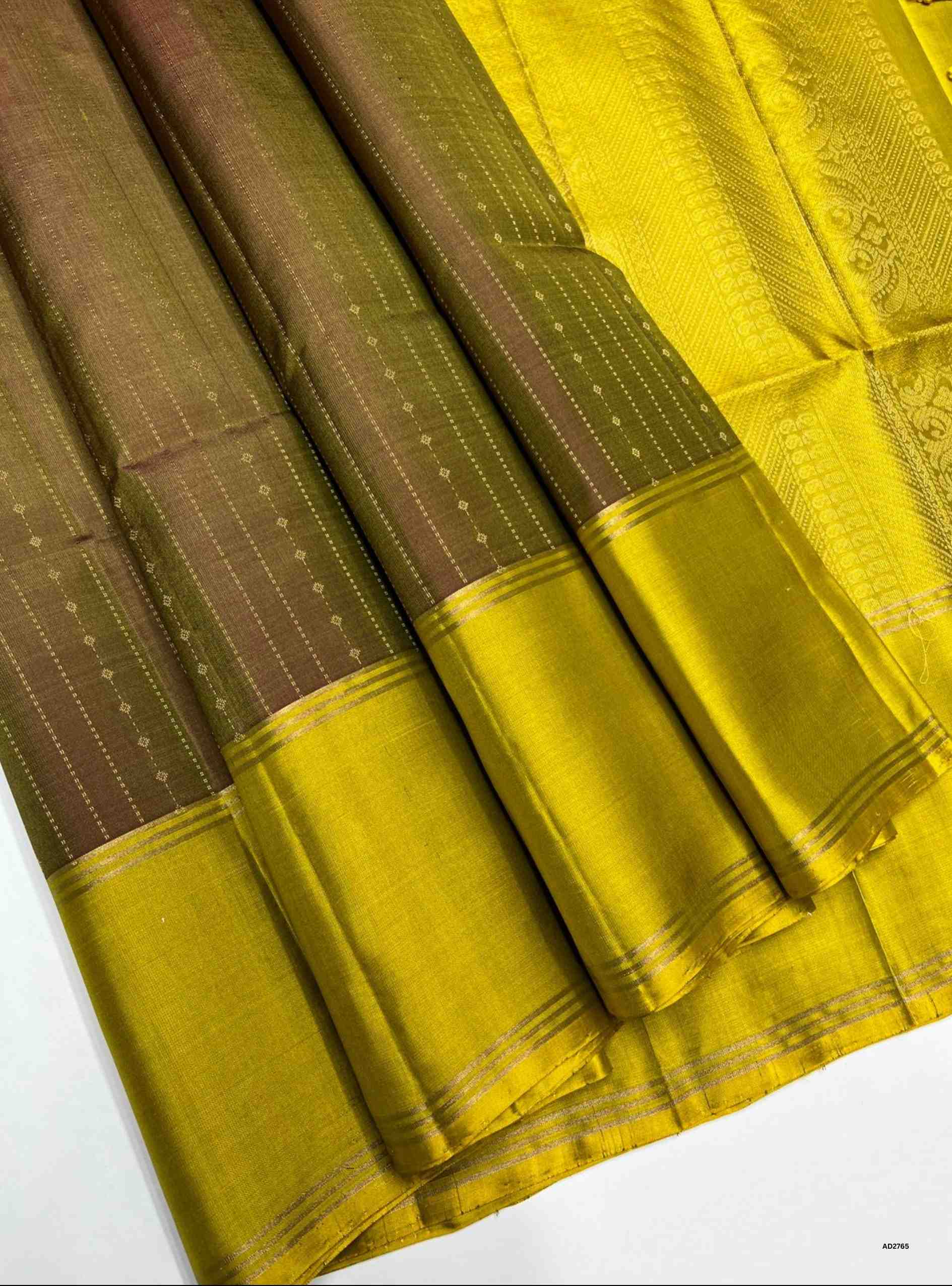 Brown and Yellow Bhutta with Stripes Soft Silk Saree with gold zari motifs.