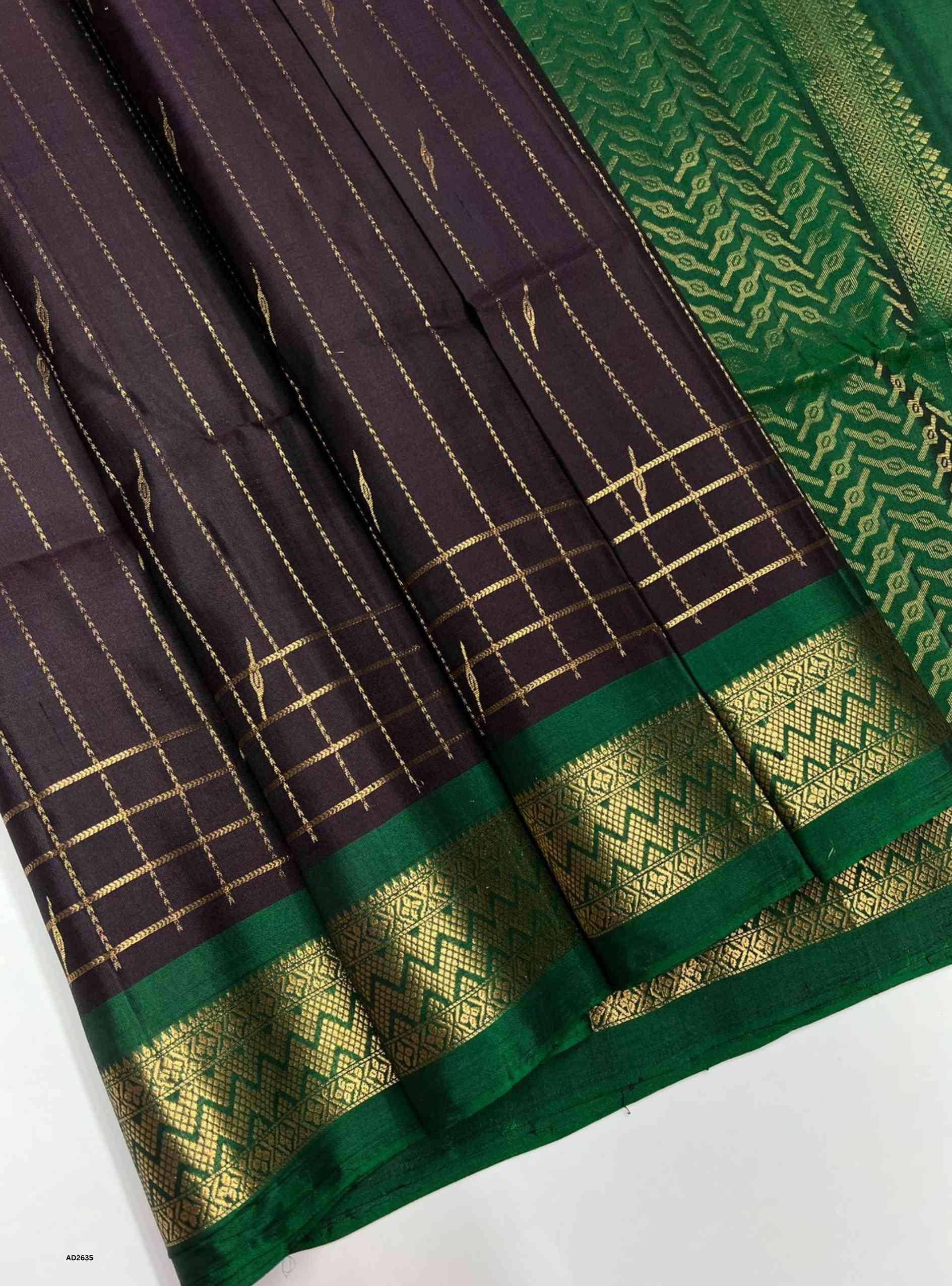 Dark Jammun and Green Soft Silk Saree with gold jacquard border motifs.