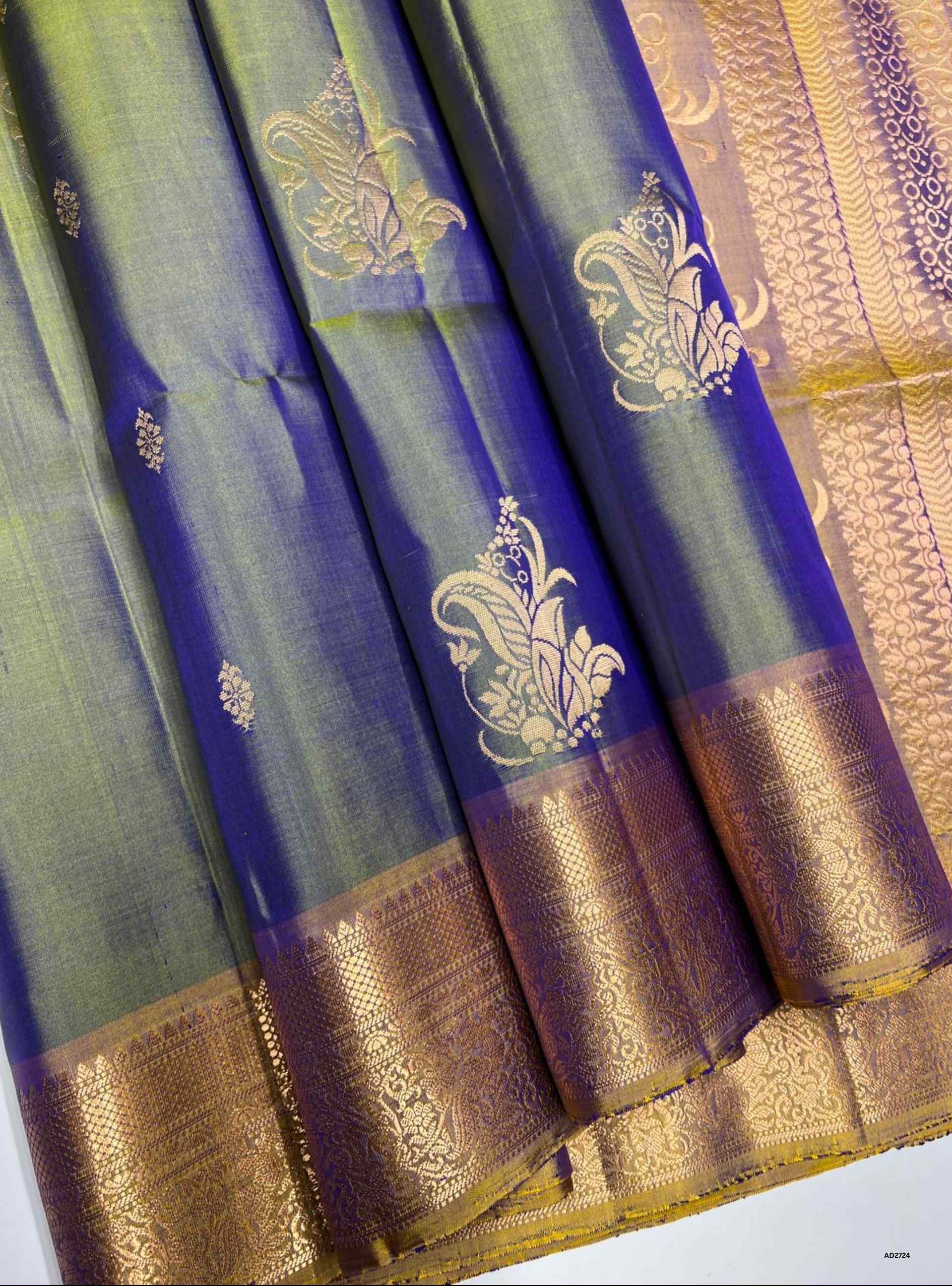 Dual Tone Green and Gold Jacquard Border Soft Silk Saree with gold zari motifs.