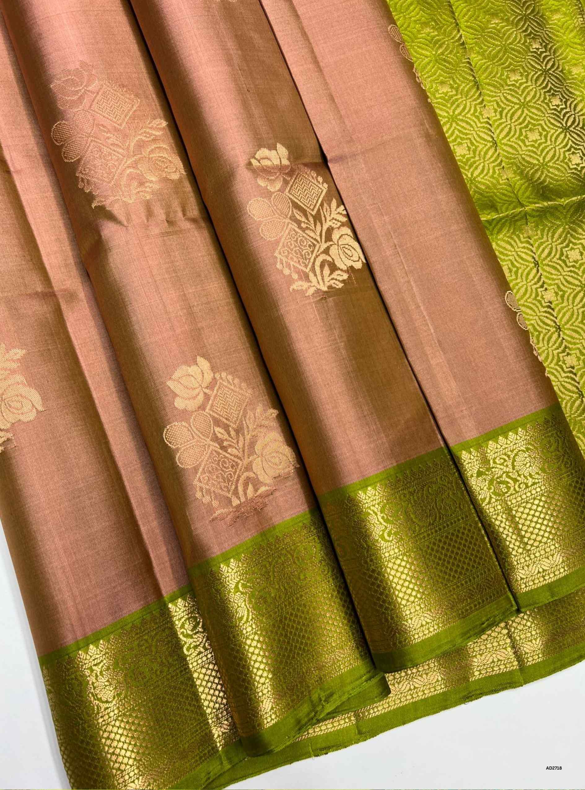 Dusty Peach and Lime Green Jacquard Border Soft Silk Saree with gold zari motifs.