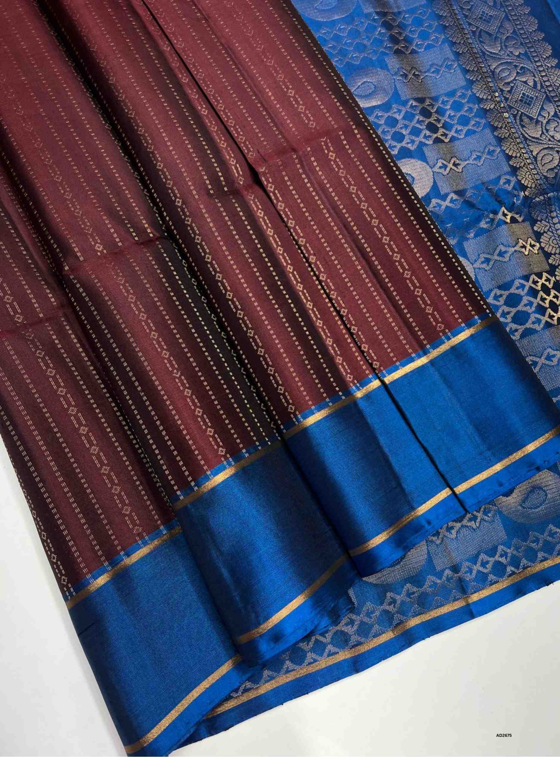Maroon and Blue Bhutta with Stripes Soft Silk Saree with gold zari motifs.