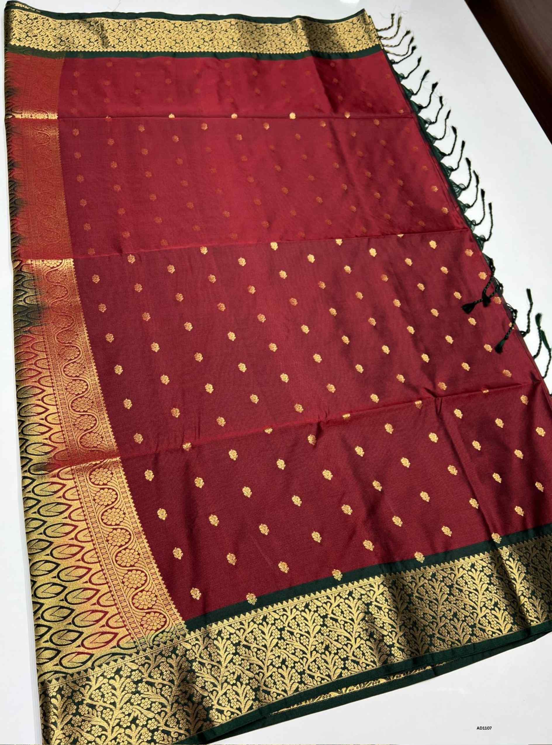 Maroon and Dark Green Semi Silk Saree with delicate gold buttas and rich Dark Green border, 5.5m length plus blouse.