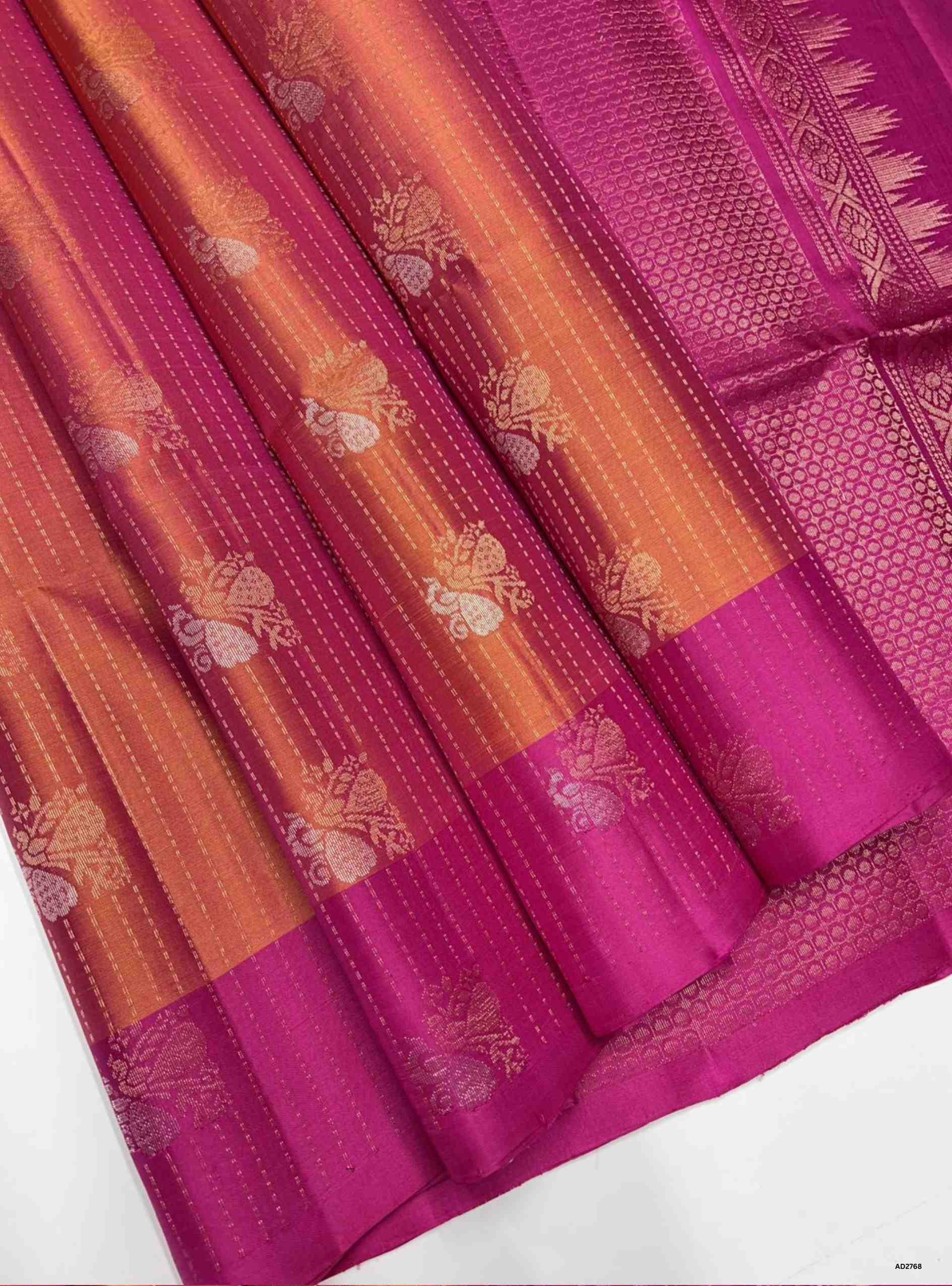 Orange and Pink Bhutta with Stripes Soft Silk Saree with gold zari motifs.