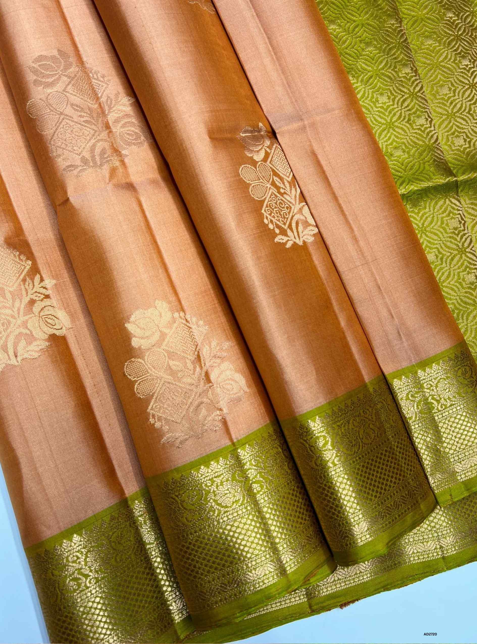 Peach and Neem Green Jacquard Border Soft Silk Saree with gold zari motifs.
